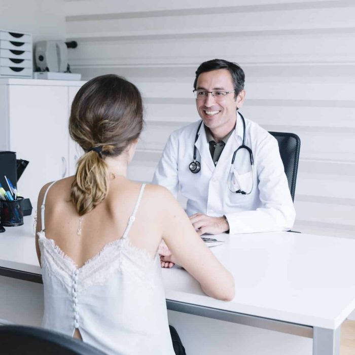 Male doctor with female patient